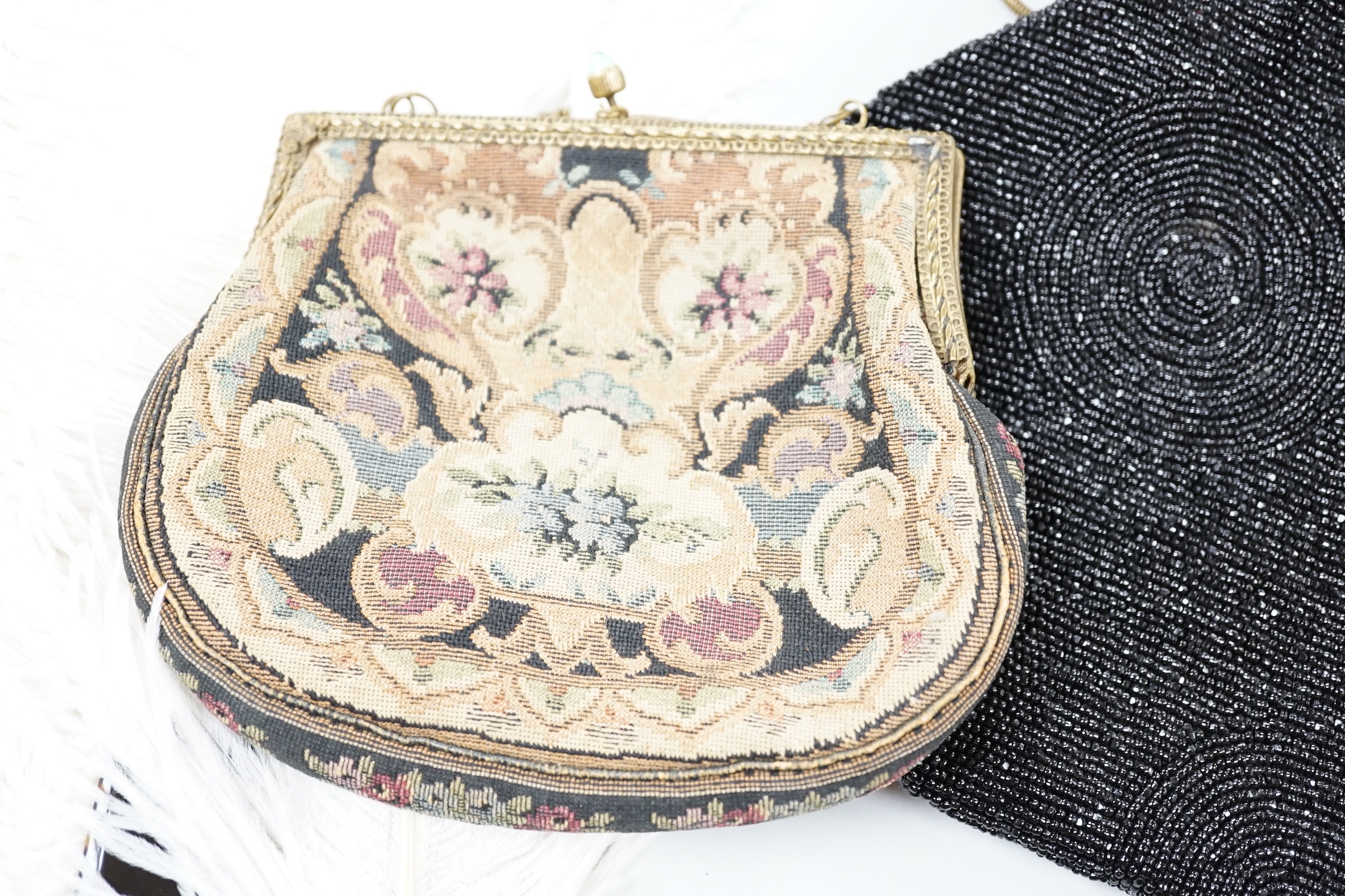 A beadwork bag and a petit point bag with a tortoiseshell and ostrich feather fan, bead bag 19cm high